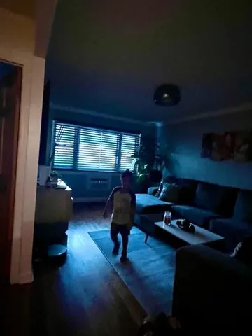 a living room with a table and chairs