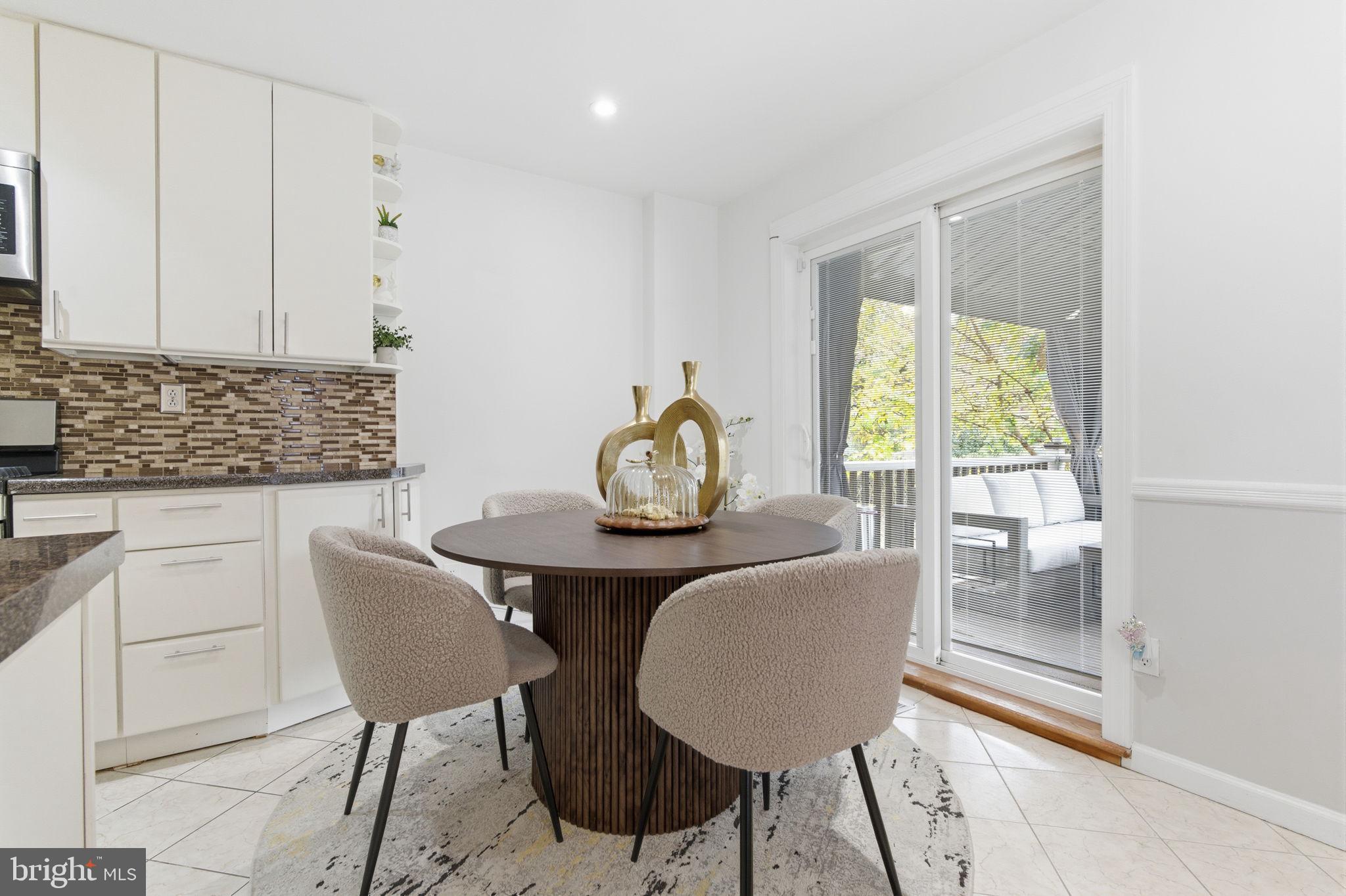 148 Rennard Street Philadelphia, PA 19116 - Photo 11 of 31 a dining room with furniture and a window