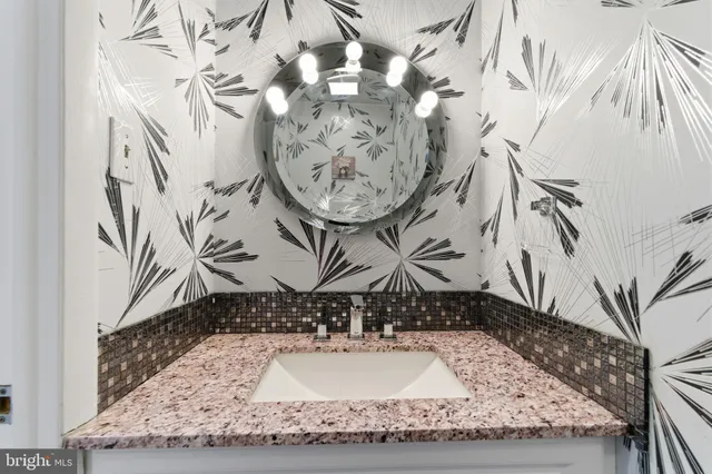 a view of a hallway with wooden floor and entryway