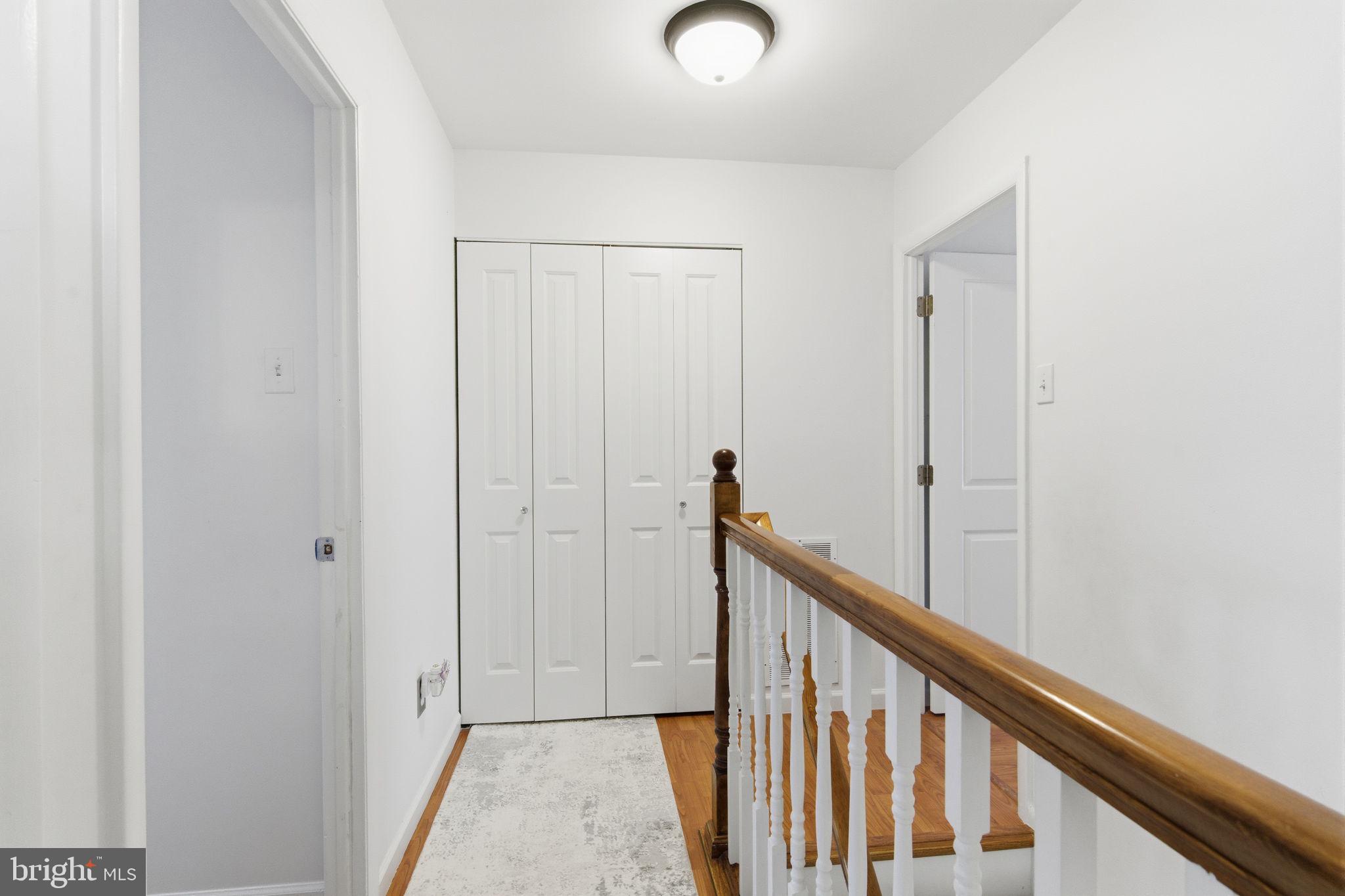 148 Rennard Street Philadelphia, PA 19116 - Photo 13 of 31 a view of a hallway with wooden floor and entryway