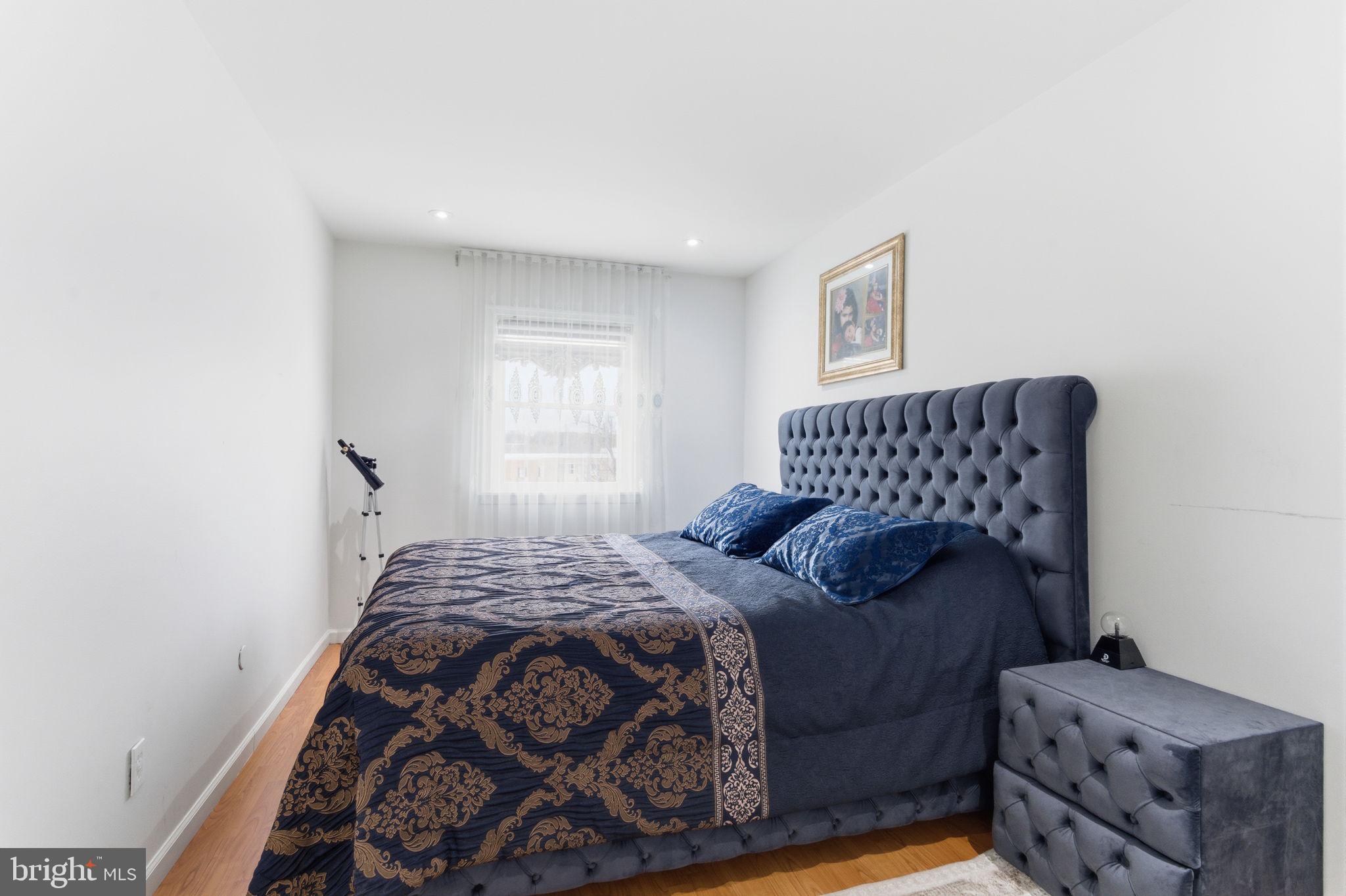 148 Rennard Street Philadelphia, PA 19116 - Photo 14 of 31 a bedroom with a bed and window