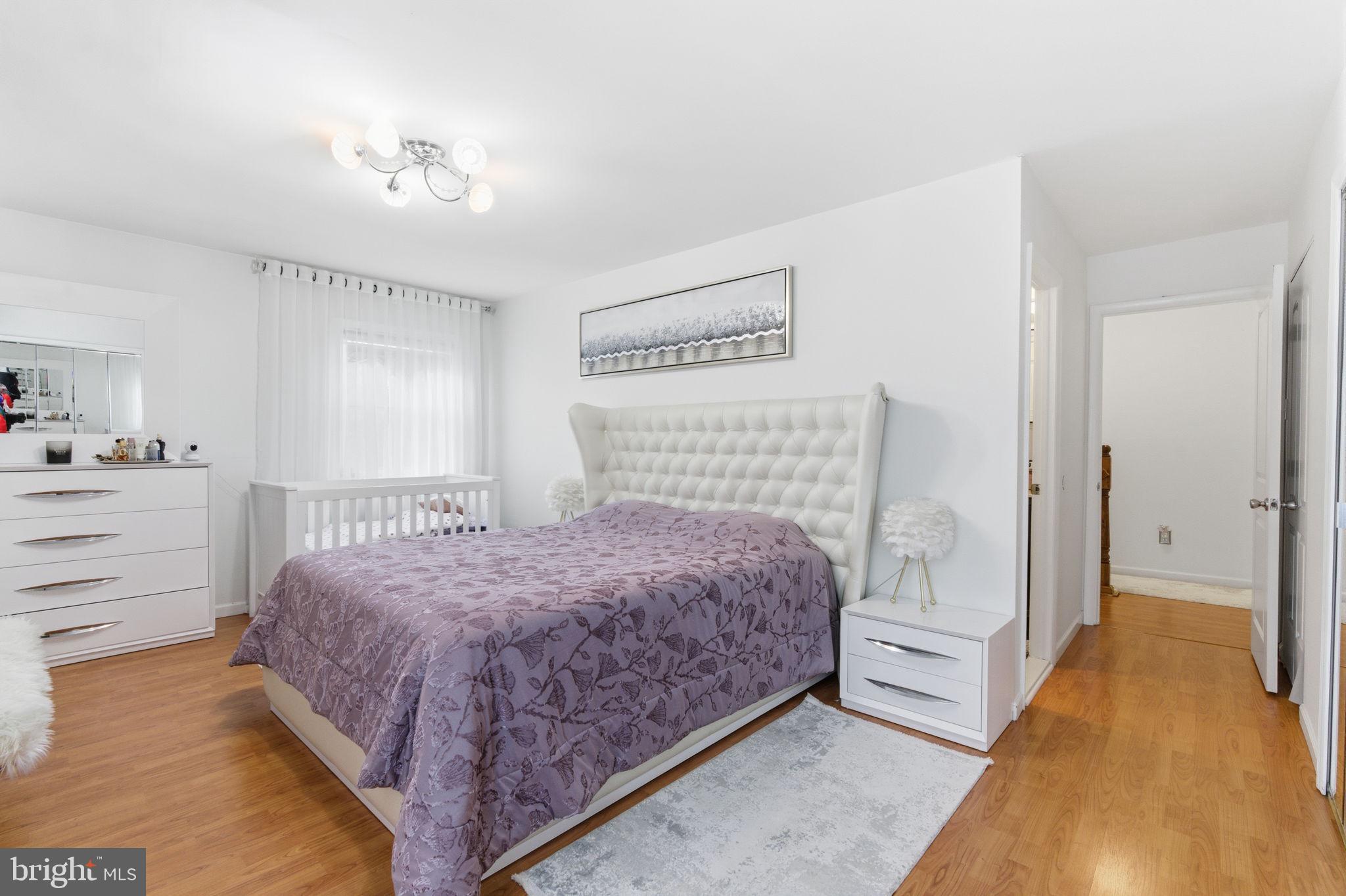 148 Rennard Street Philadelphia, PA 19116 - Photo 18 of 31 a bedroom with a bed and closet