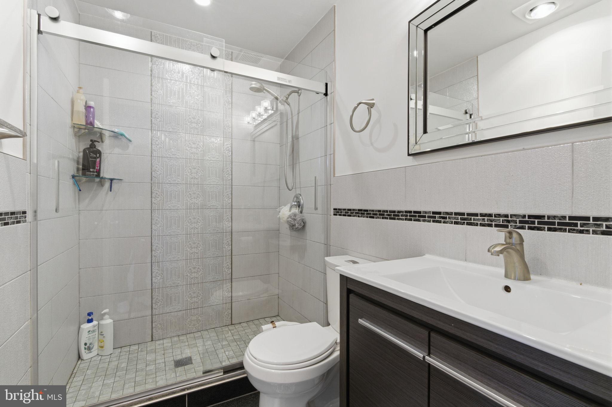 148 Rennard Street Philadelphia, PA 19116 - Photo 20 of 31 a bathroom with a sink toilet and shower