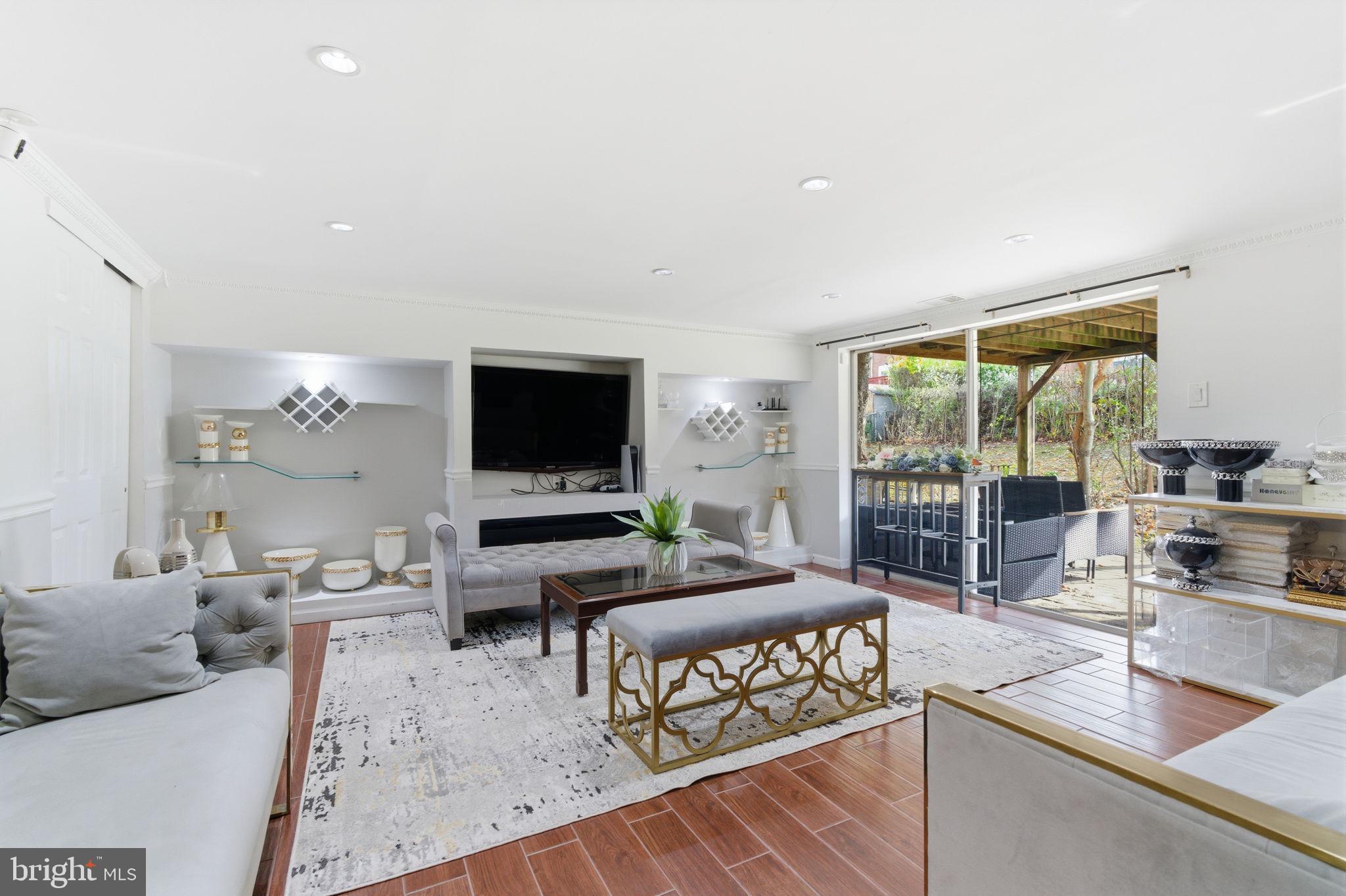 148 Rennard Street Philadelphia, PA 19116 - Photo 21 of 31 a living room with furniture and a flat screen tv