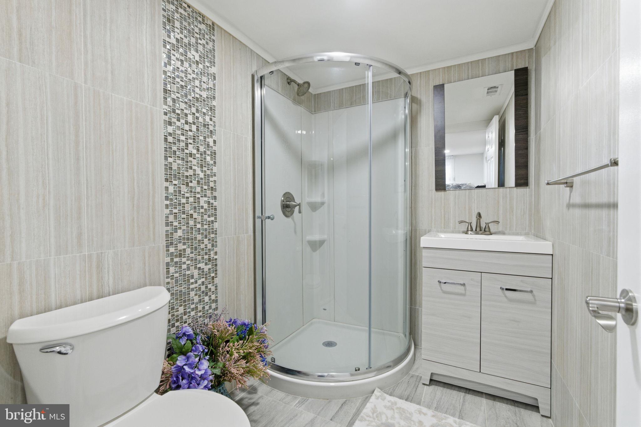 148 Rennard Street Philadelphia, PA 19116 - Photo 24 of 31 a bathroom with a sink toilet and shower