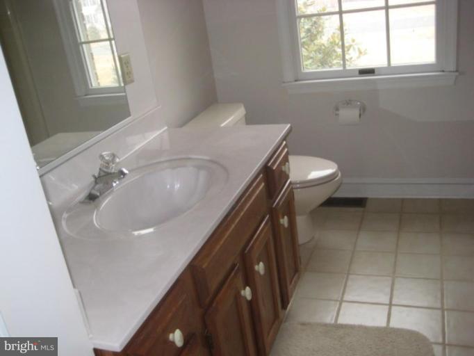 116 Sheaffer Road Chestertown, MD 21620 - Photo 12 of 21 a bathroom with a sink a toilet and window
