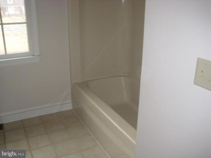 116 Sheaffer Road Chestertown, MD 21620 - Photo 13 of 21 a white bath tub sitting in a bathroom