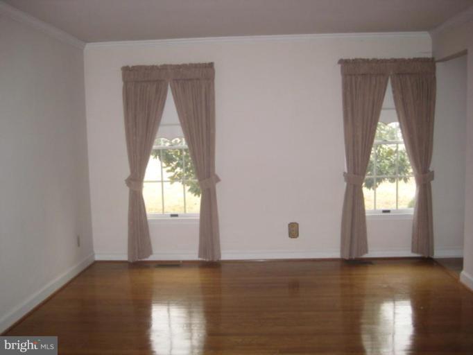 116 Sheaffer Road Chestertown, MD 21620 - Photo 20 of 21 an empty room with wooden floor and windows