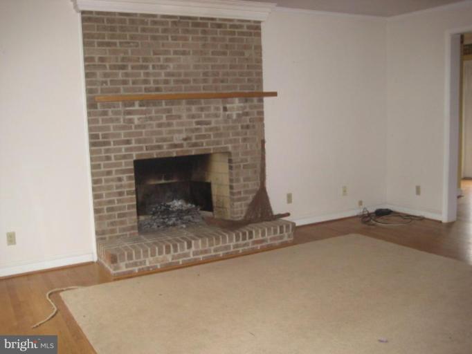 116 Sheaffer Road Chestertown, MD 21620 - Photo 3 of 21 a living room with a fireplace