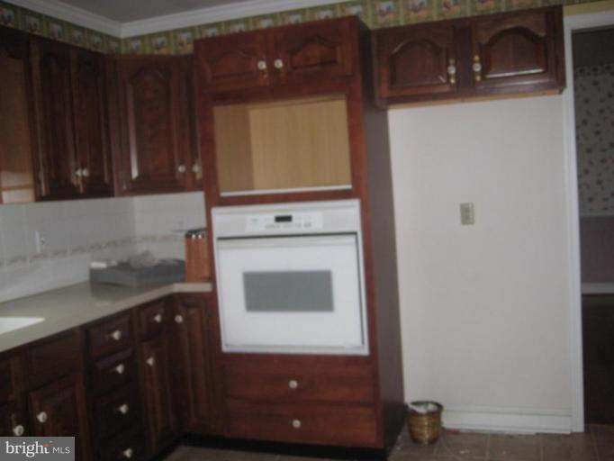 116 Sheaffer Road Chestertown, MD 21620 - Photo 6 of 21 a kitchen with a sink and a washer dryer