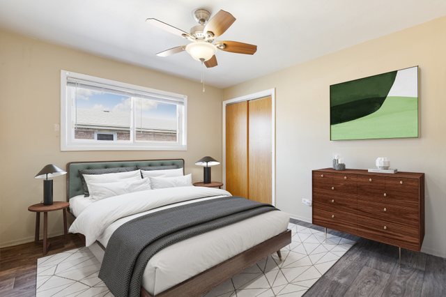 14929 Cleveland Avenue Posen, IL 60469 - Photo 14 of 21 a bedroom with a bed and a flat screen tv