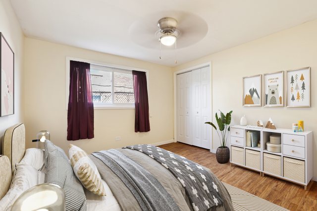 14929 Cleveland Avenue Posen, IL 60469 - Photo 6 of 21 a bedroom with a bed and wooden floor