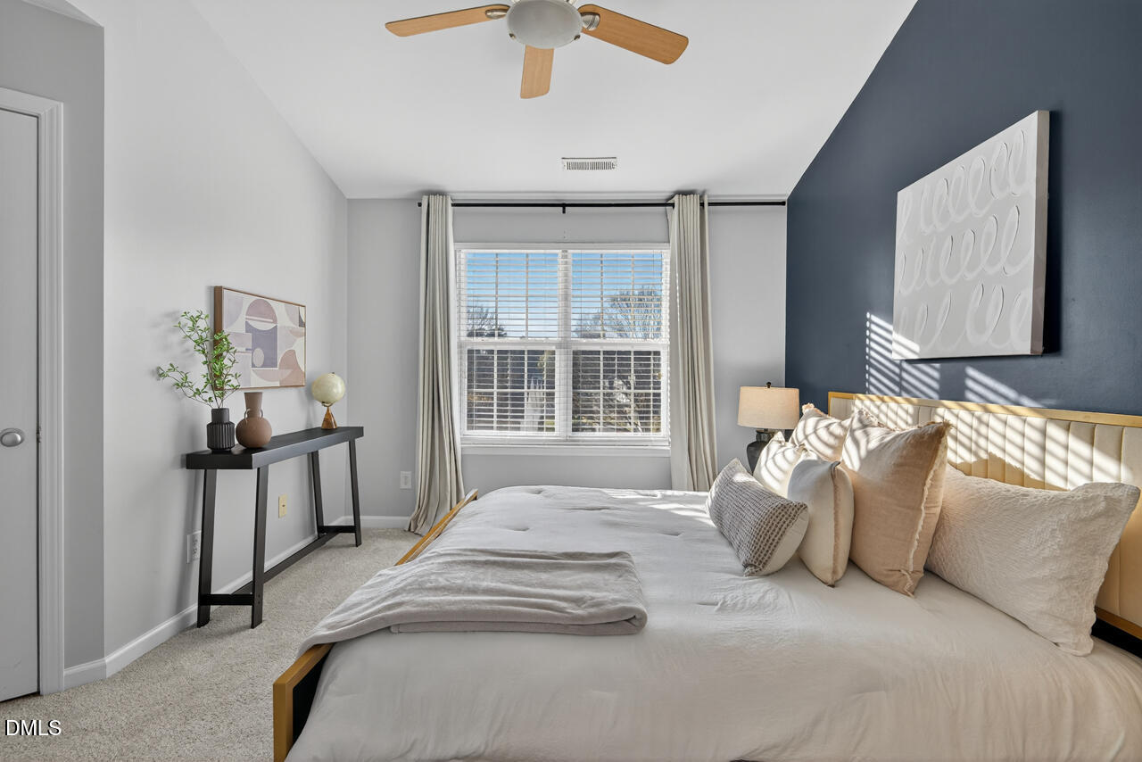 3811 Ramblewood Avenue Durham, NC 27713 - Photo 18 of 27 a bedroom with a bed and a window