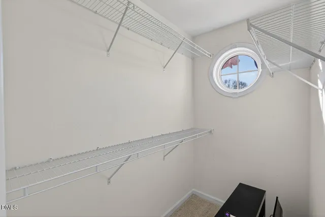 a view of a small space with racks on the wall