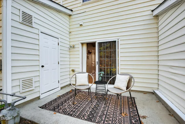 a bench sitting in front of a white house