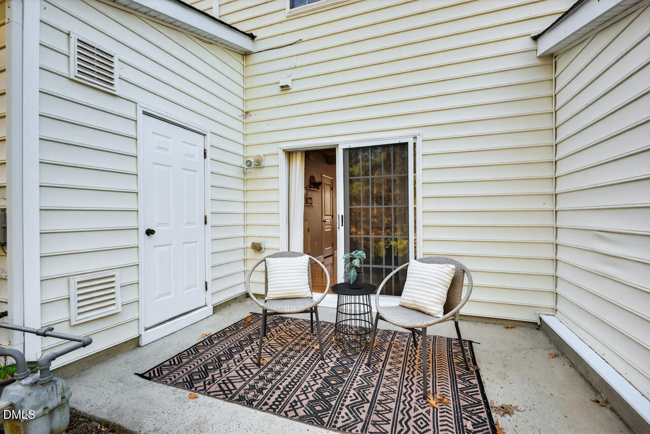 3811 Ramblewood Avenue Durham, NC 27713 - Photo 25 of 27 a bench sitting in front of a white house