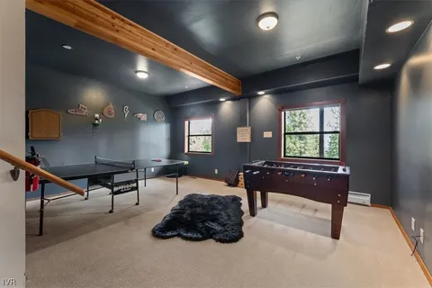 a bedroom with furniture and a window