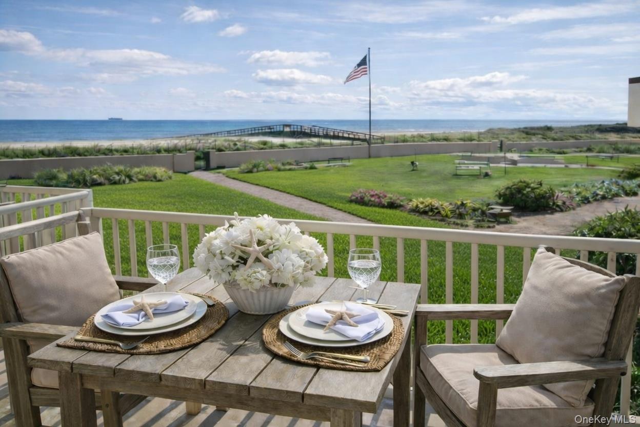 2 Richmond Road, Unit 2A Lido Beach, NY 11561 - Photo 1 of 12 a view of a chair and table on the terrace