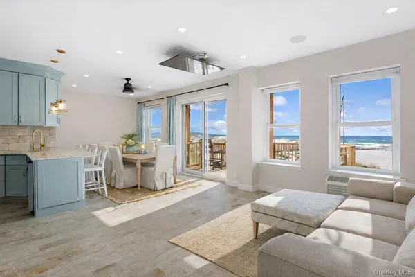 a living room with furniture and windows