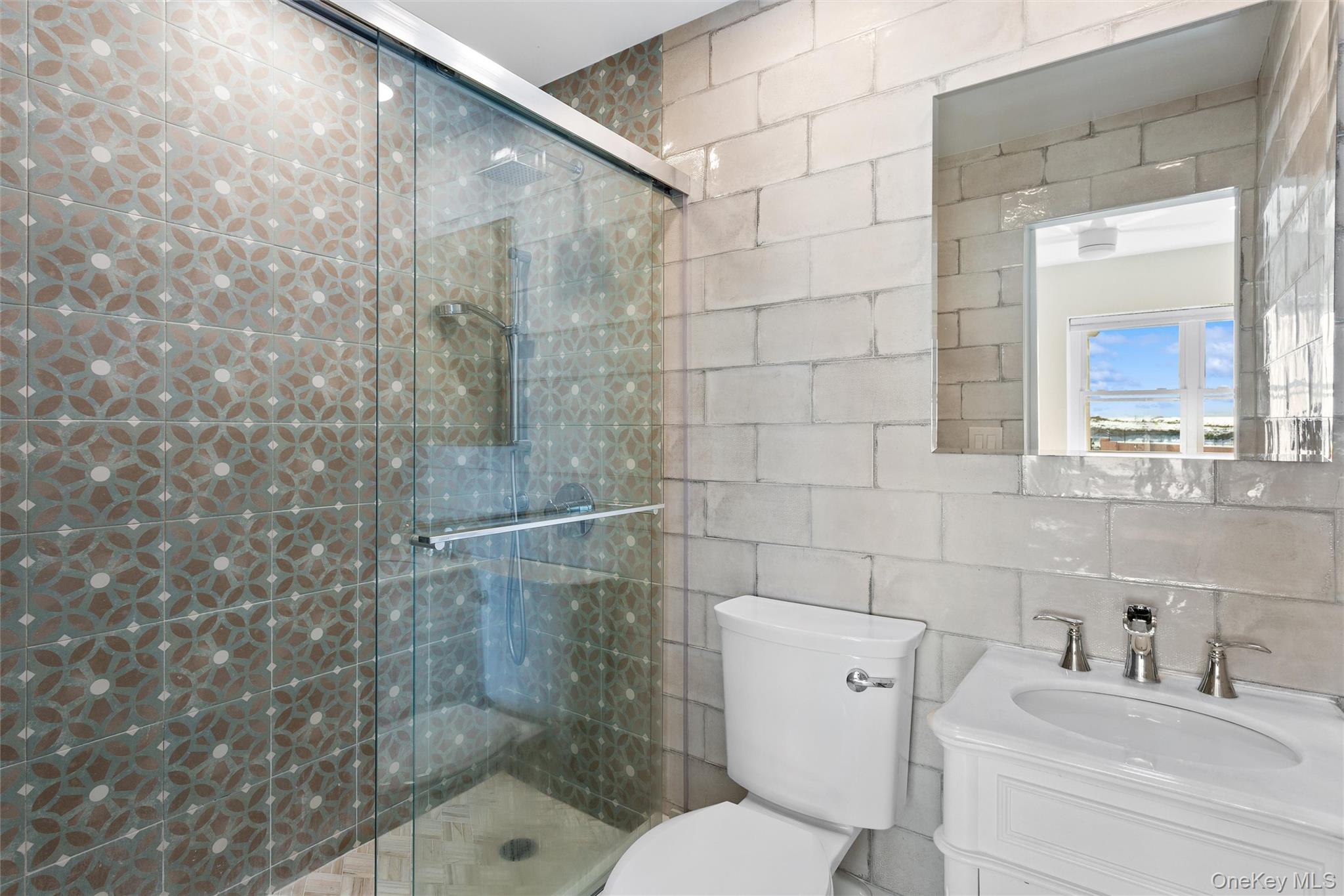 2 Richmond Road, Unit 2A Lido Beach, NY 11561 - Photo 7 of 12 a bathroom with a toilet sink and shower