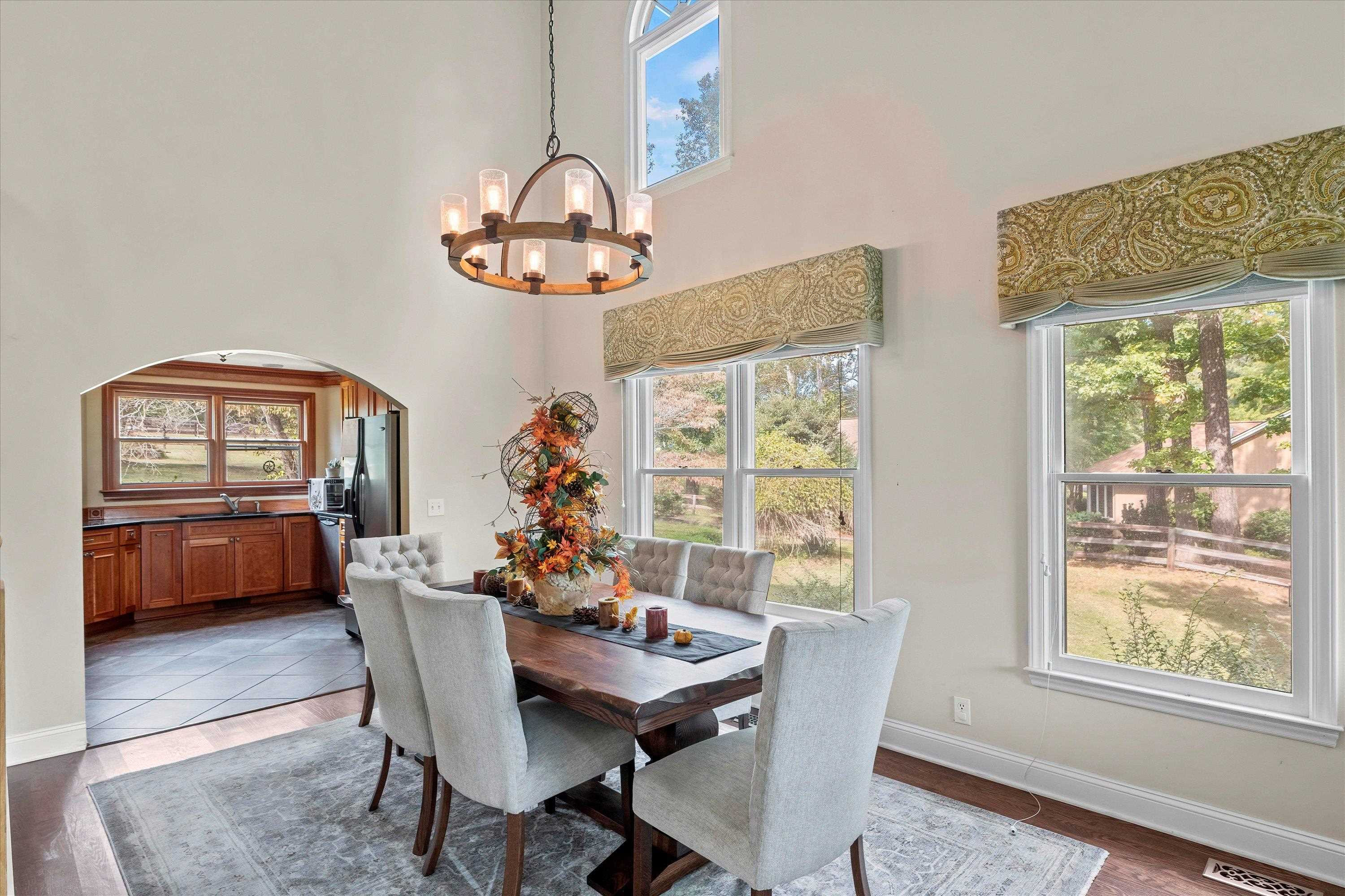 3509 Old Milburnie Road Raleigh, NC 27616 - Photo 12 of 74 a dining room with furniture a chandelier and window