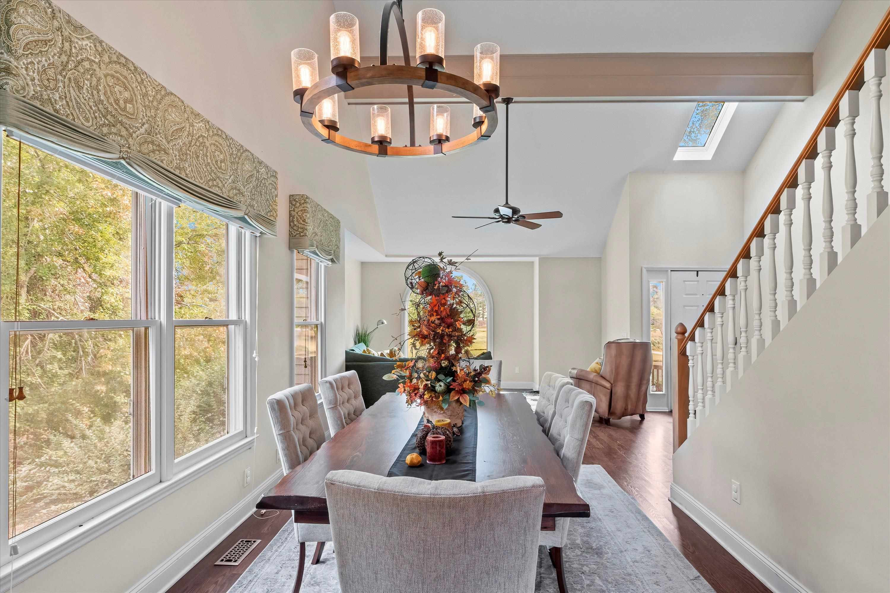 3509 Old Milburnie Road Raleigh, NC 27616 - Photo 13 of 74 a living room with furniture chandelier and a large window