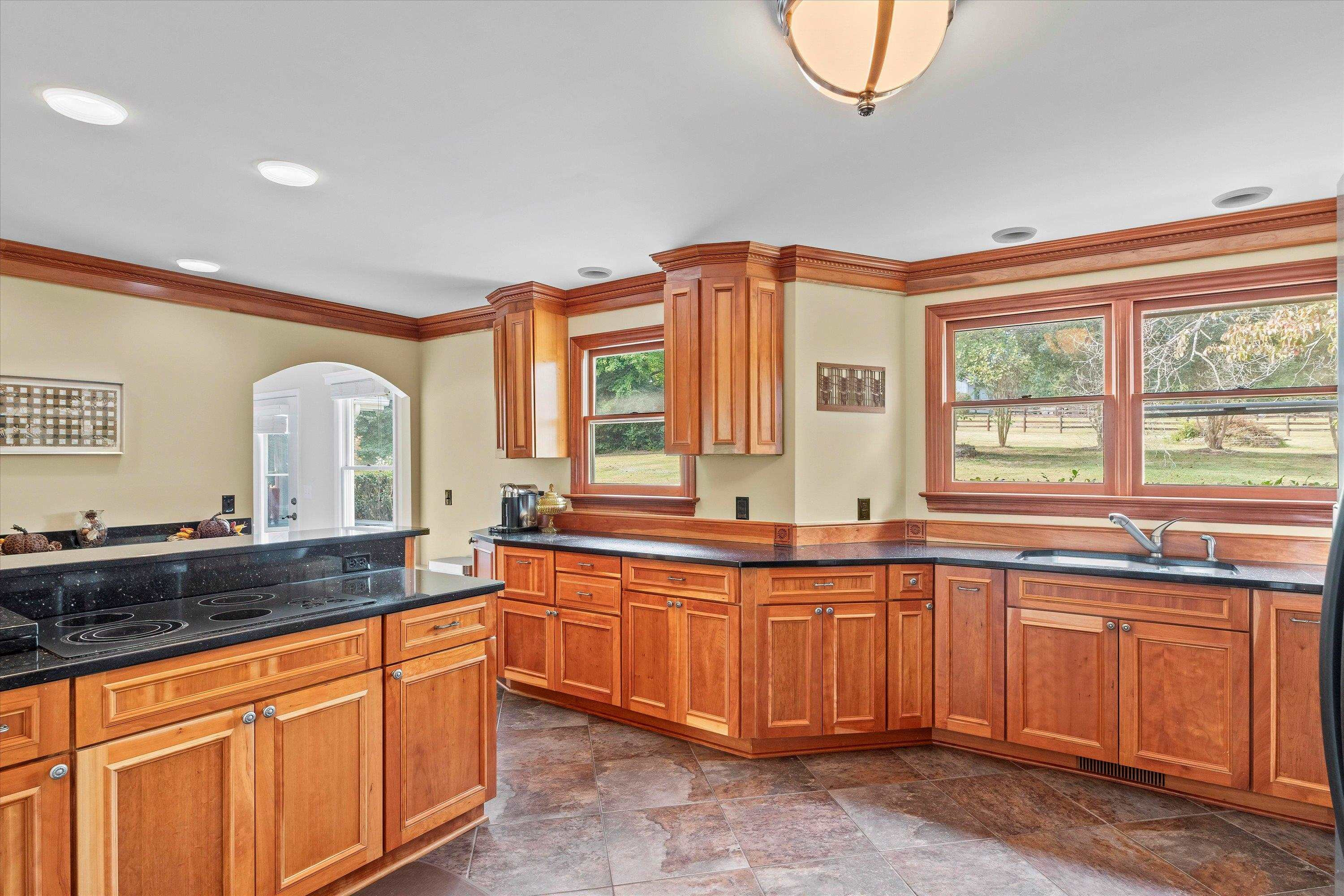 3509 Old Milburnie Road Raleigh, NC 27616 - Photo 14 of 74 a large kitchen with a large window and cabinets