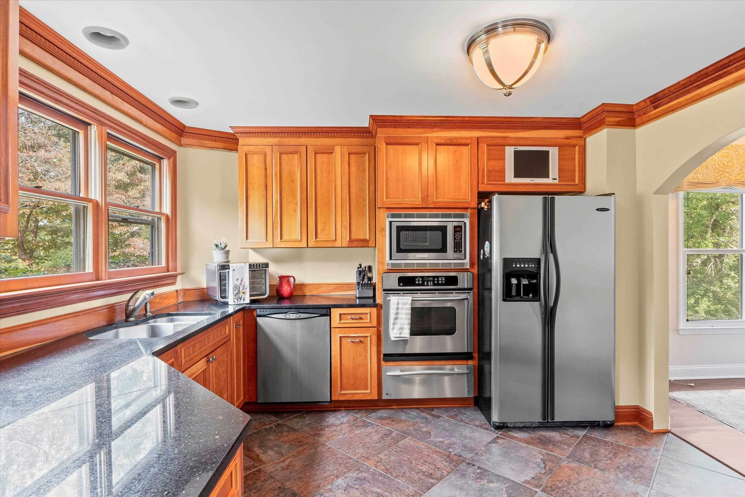 3509 Old Milburnie Road Raleigh, NC 27616 - Photo 16 of 74 a kitchen with stainless steel appliances granite countertop a refrigerator and a sink
