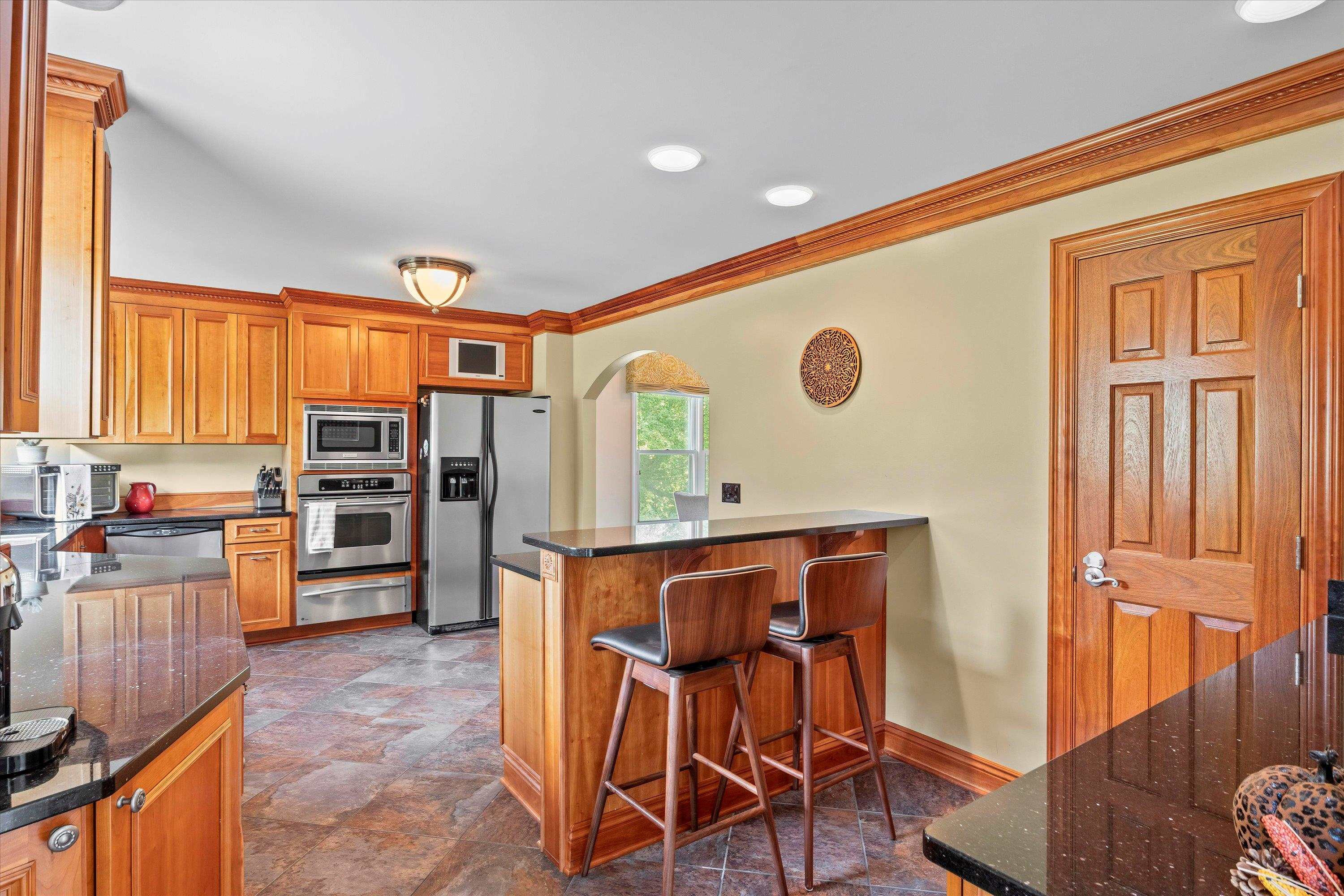 3509 Old Milburnie Road Raleigh, NC 27616 - Photo 17 of 74 a view of a kitchen with furniture and wooden floor