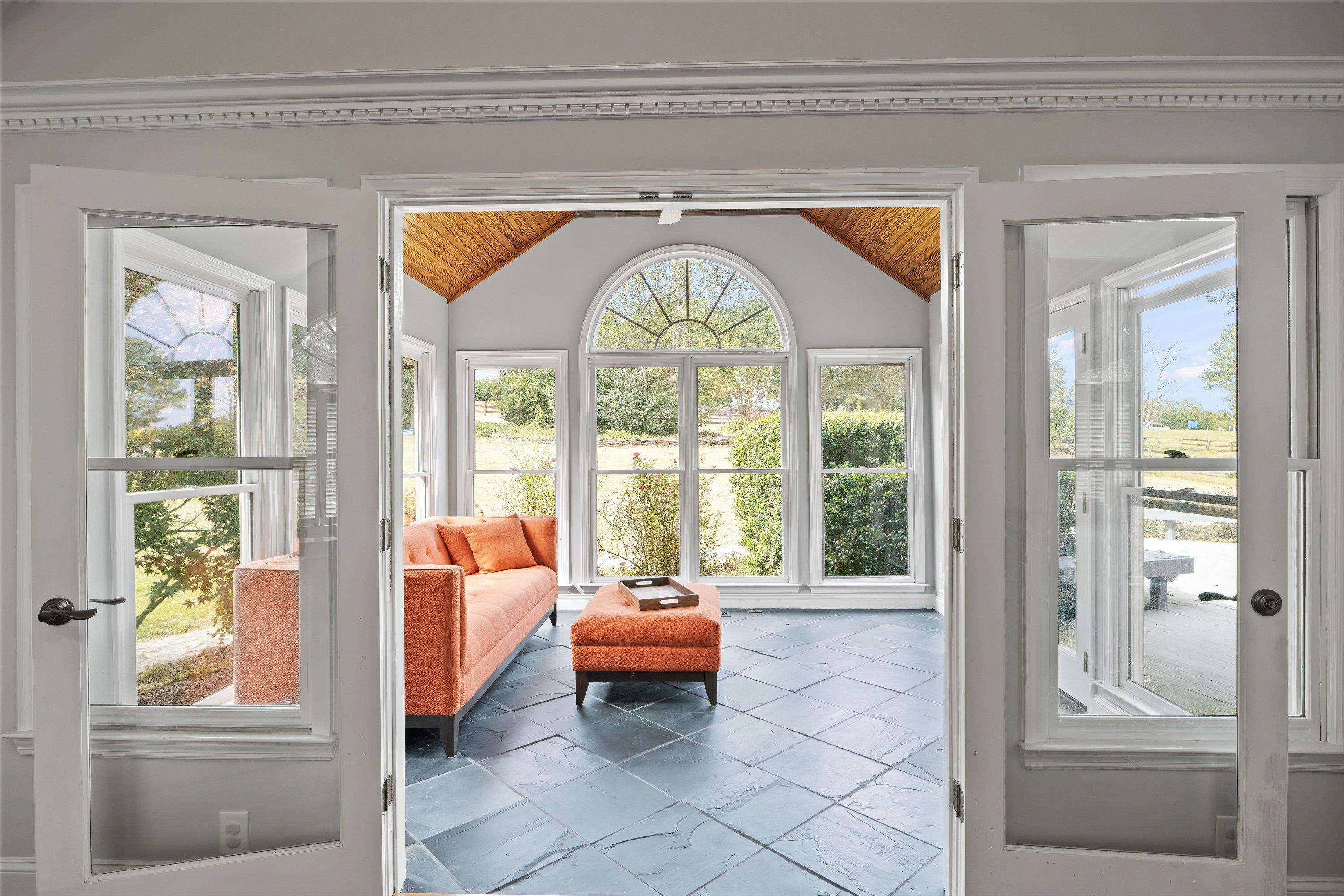3509 Old Milburnie Road Raleigh, NC 27616 - Photo 27 of 74 a living room with a large window and a chandelier