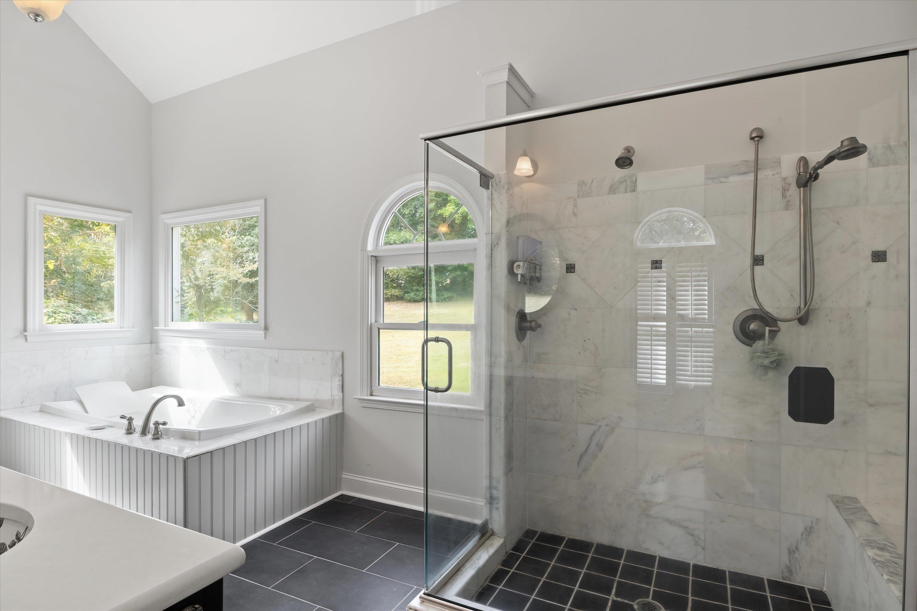 3509 Old Milburnie Road Raleigh, NC 27616 - Photo 31 of 74 a bathroom with a tub a sink and a shower