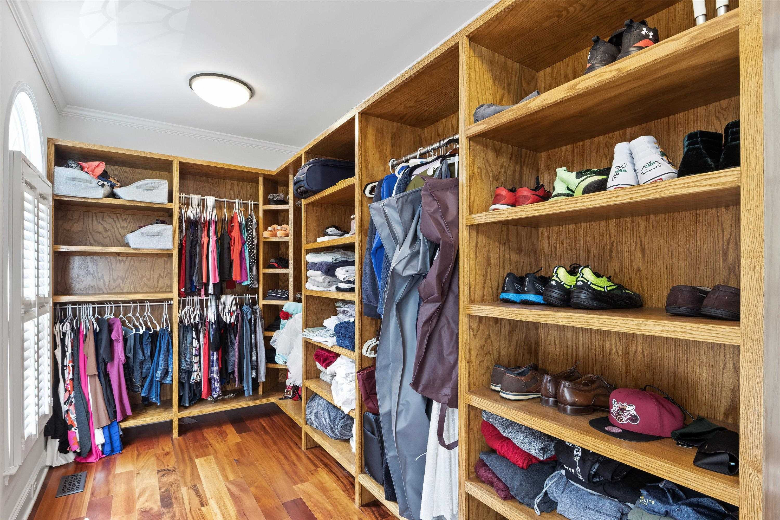 3509 Old Milburnie Road Raleigh, NC 27616 - Photo 32 of 74 a view of walk in closet with clothes and shoes