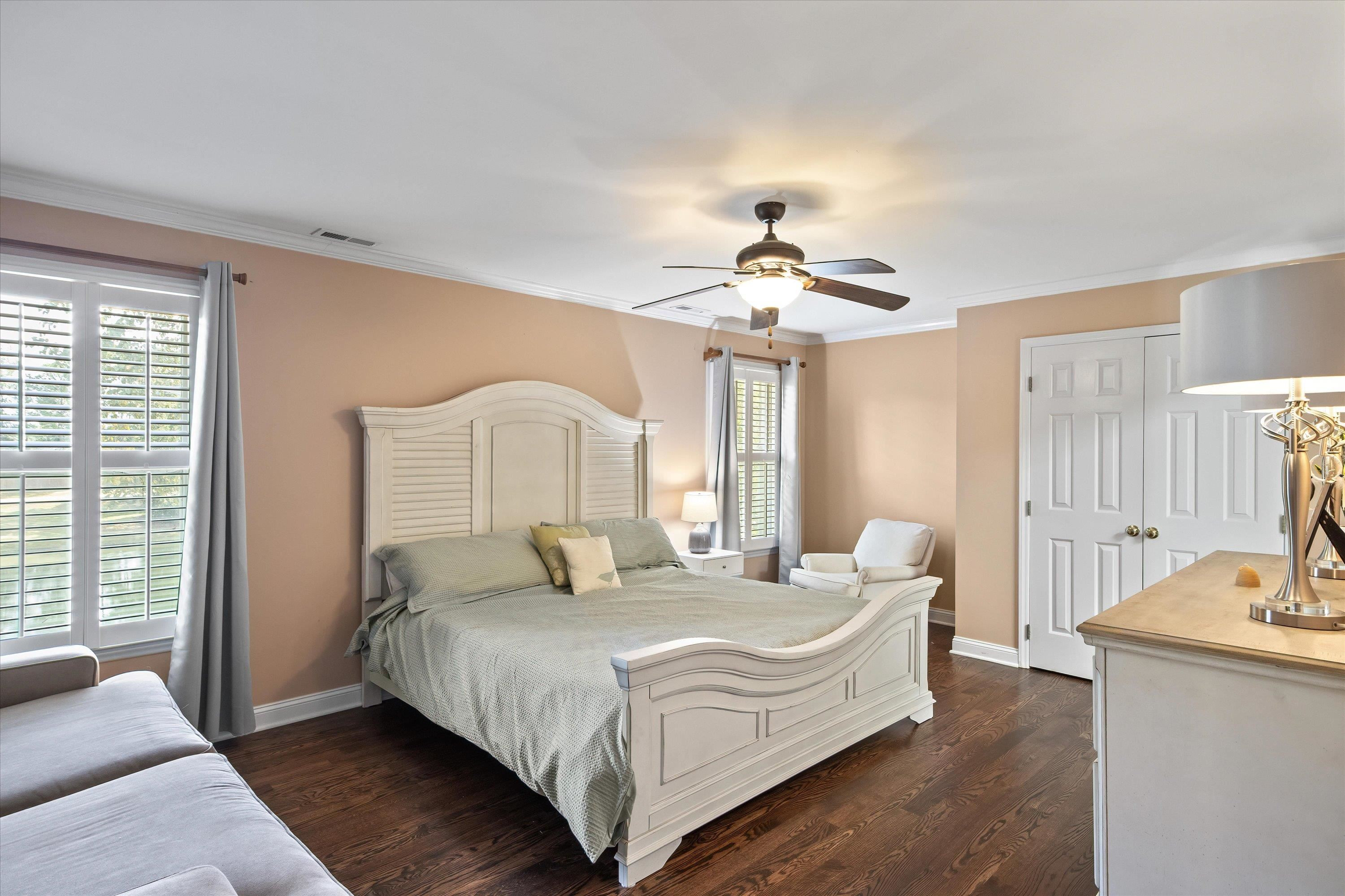 3509 Old Milburnie Road Raleigh, NC 27616 - Photo 36 of 74 a spacious bedroom with a bed and a chandelier