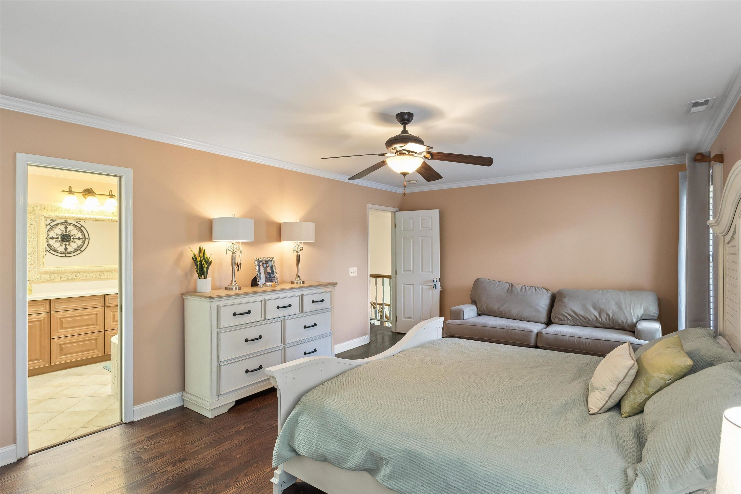 3509 Old Milburnie Road Raleigh, NC 27616 - Photo 37 of 74 a spacious bedroom with a bed and a chandelier
