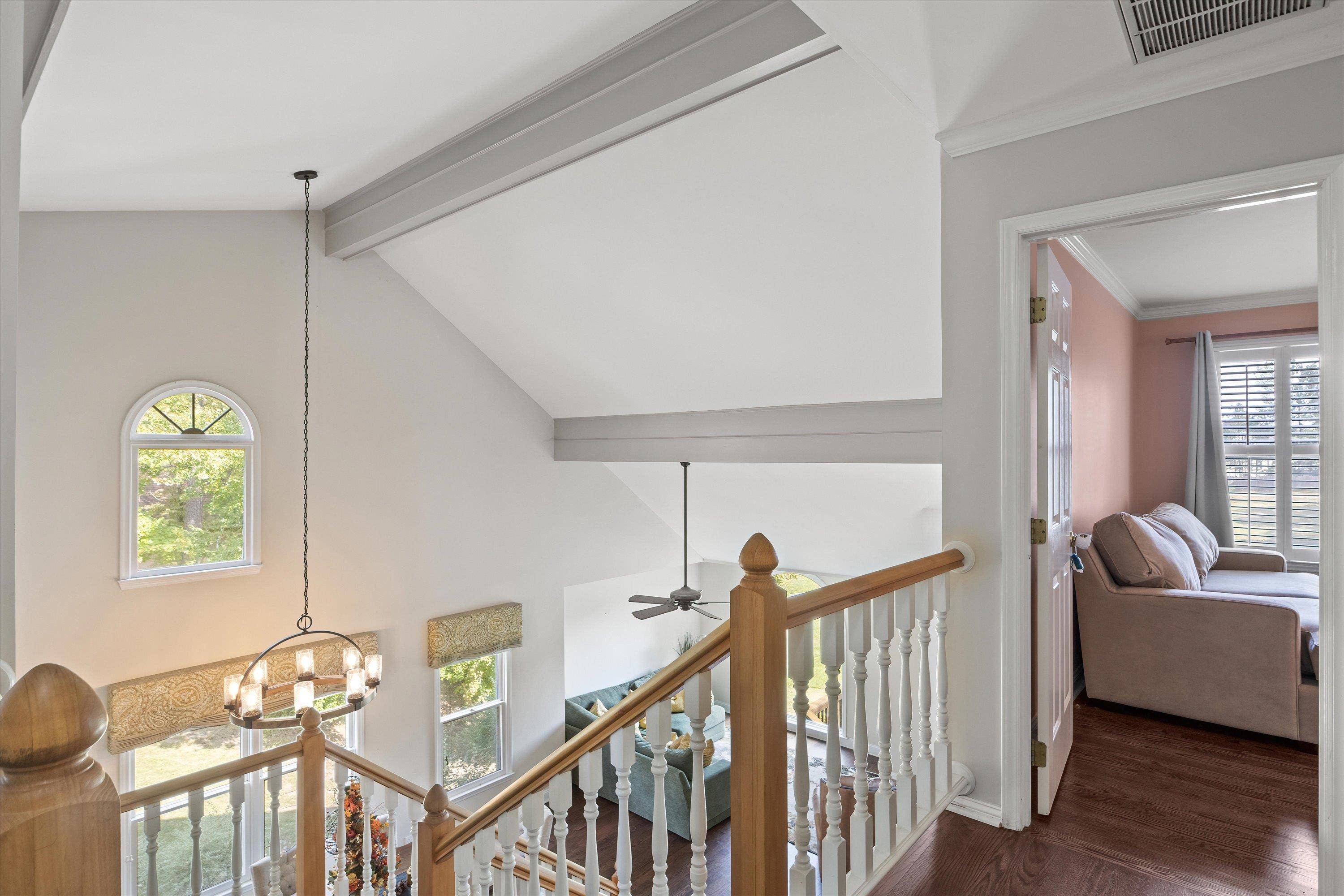 3509 Old Milburnie Road Raleigh, NC 27616 - Photo 40 of 74 a view of a hallway with couches and a dining table with wooden floor