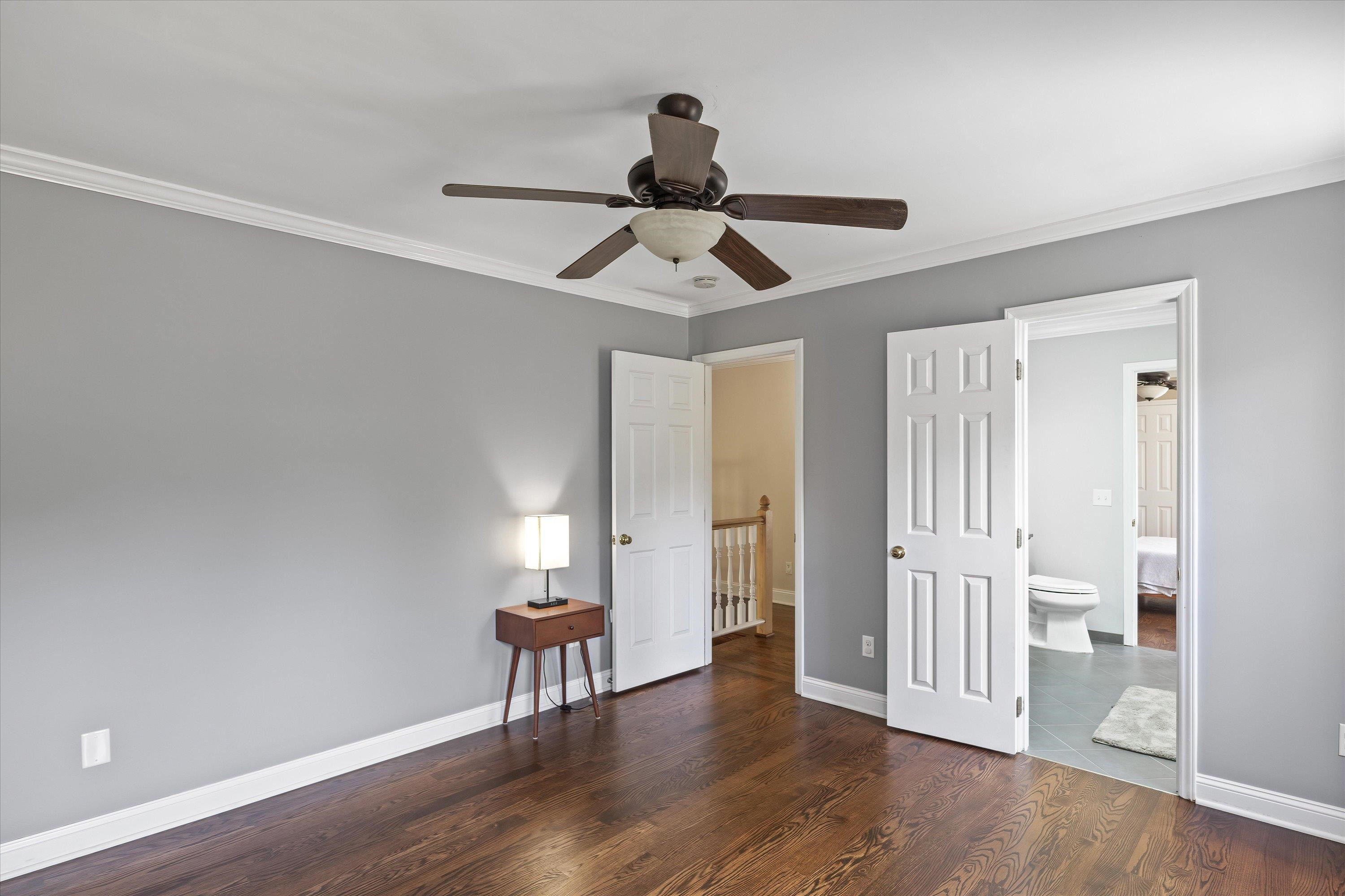 3509 Old Milburnie Road Raleigh, NC 27616 - Photo 42 of 74 a view of a livingroom with wooden floor and a ceiling fan