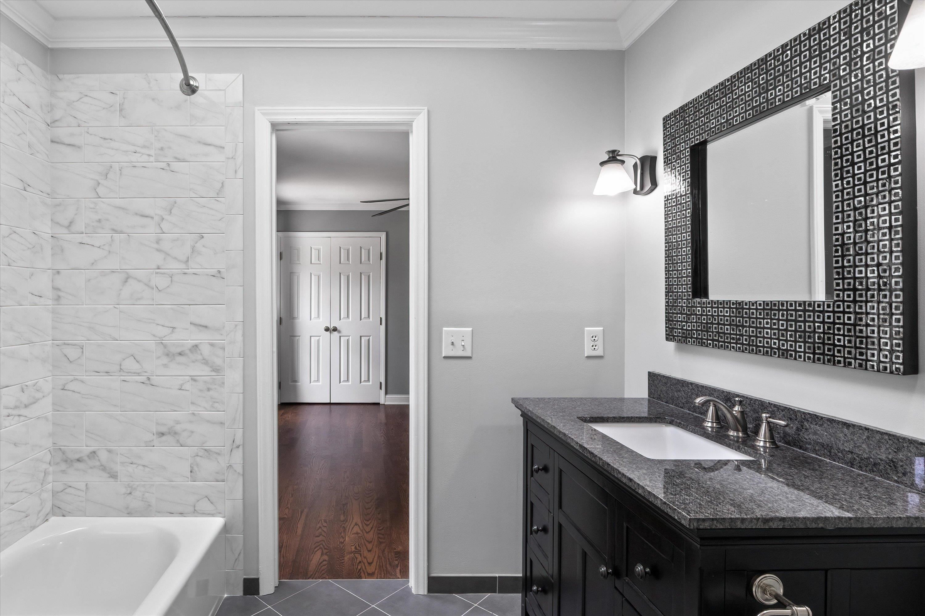 3509 Old Milburnie Road Raleigh, NC 27616 - Photo 43 of 74 a bathroom with a granite countertop sink and a mirror