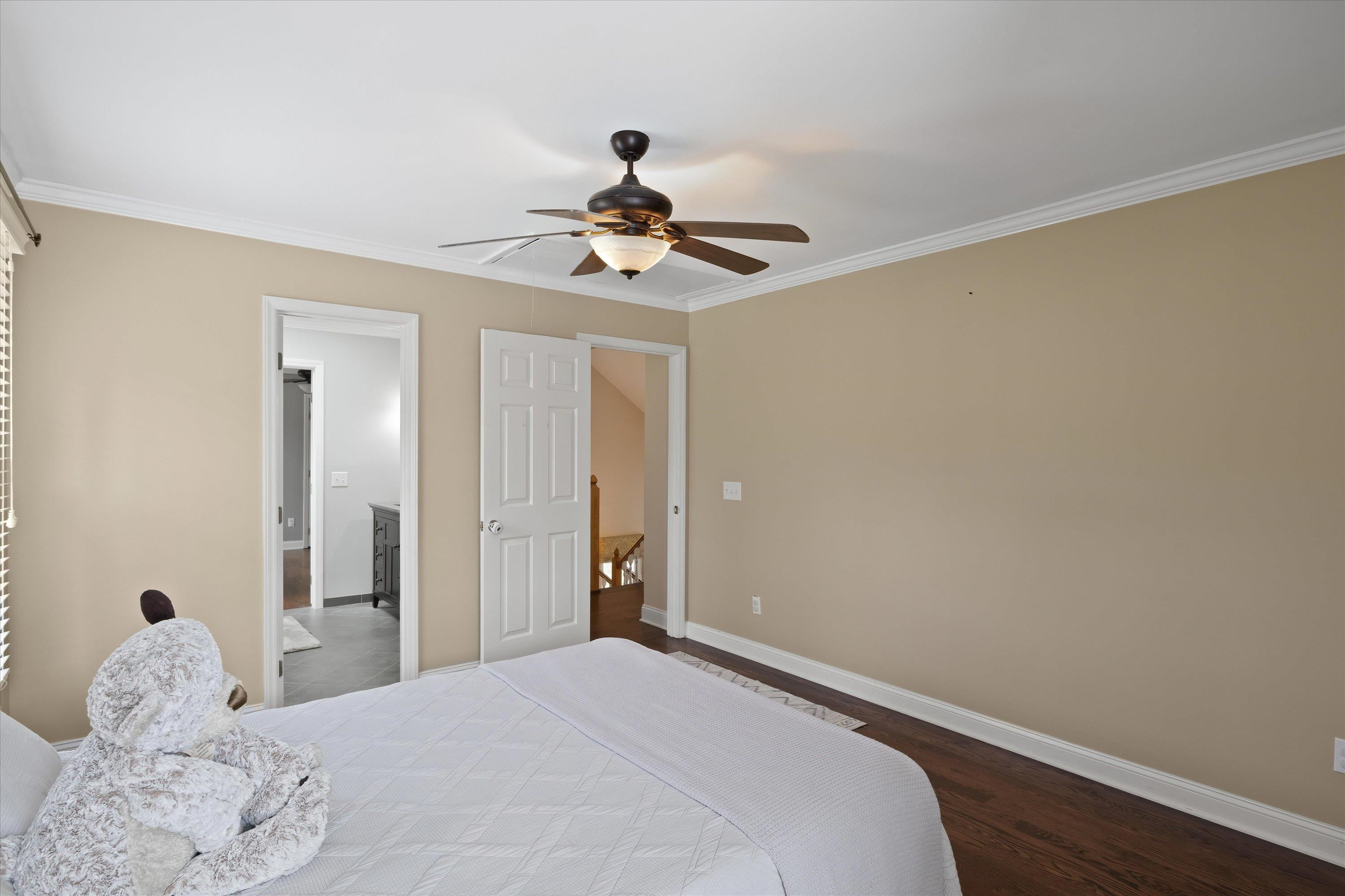 3509 Old Milburnie Road Raleigh, NC 27616 - Photo 45 of 74 a bedroom with a bed and a chandelier fan