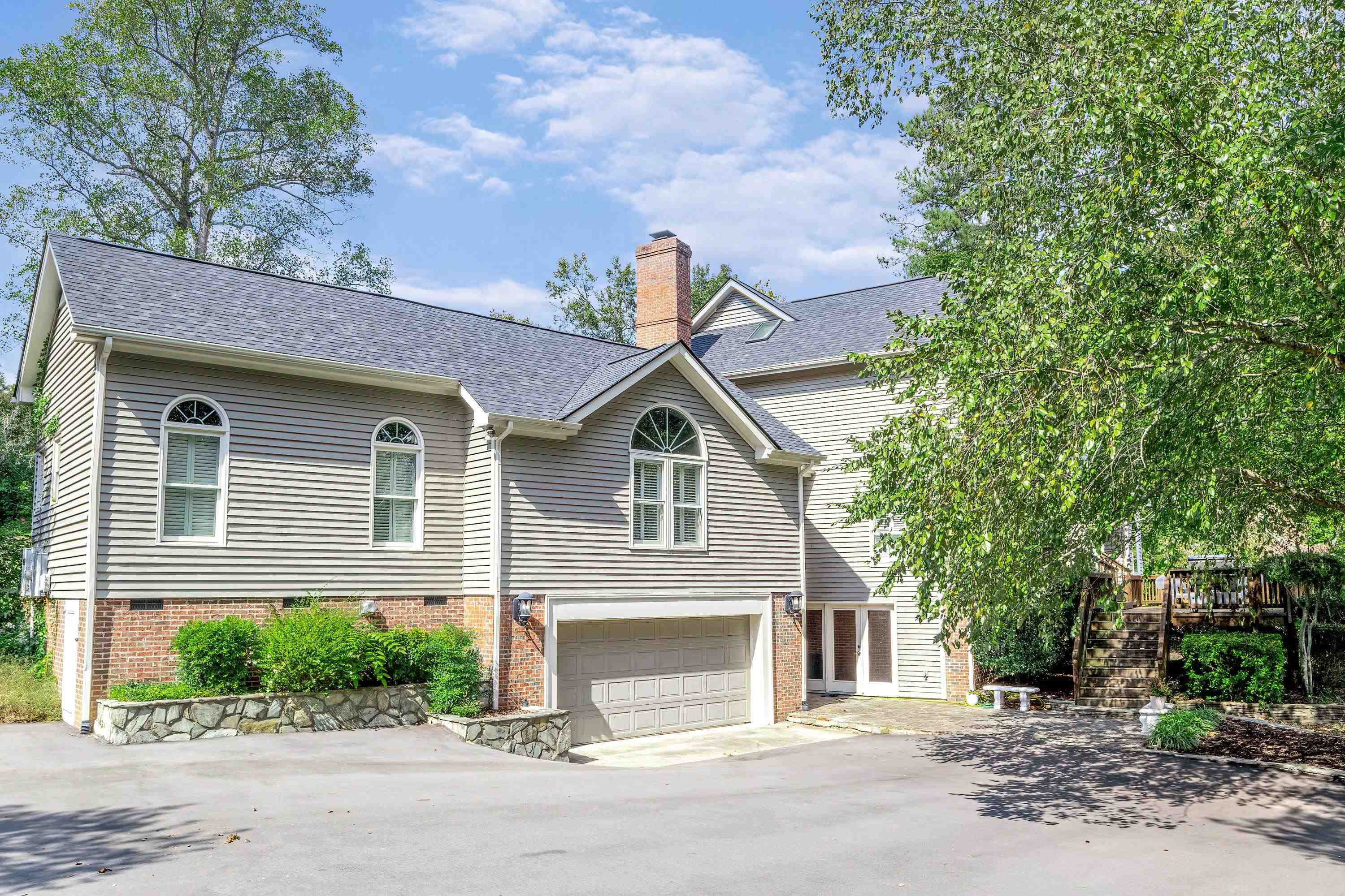 3509 Old Milburnie Road Raleigh, NC 27616 - Photo 56 of 74 a front view of a house with a yard and garage