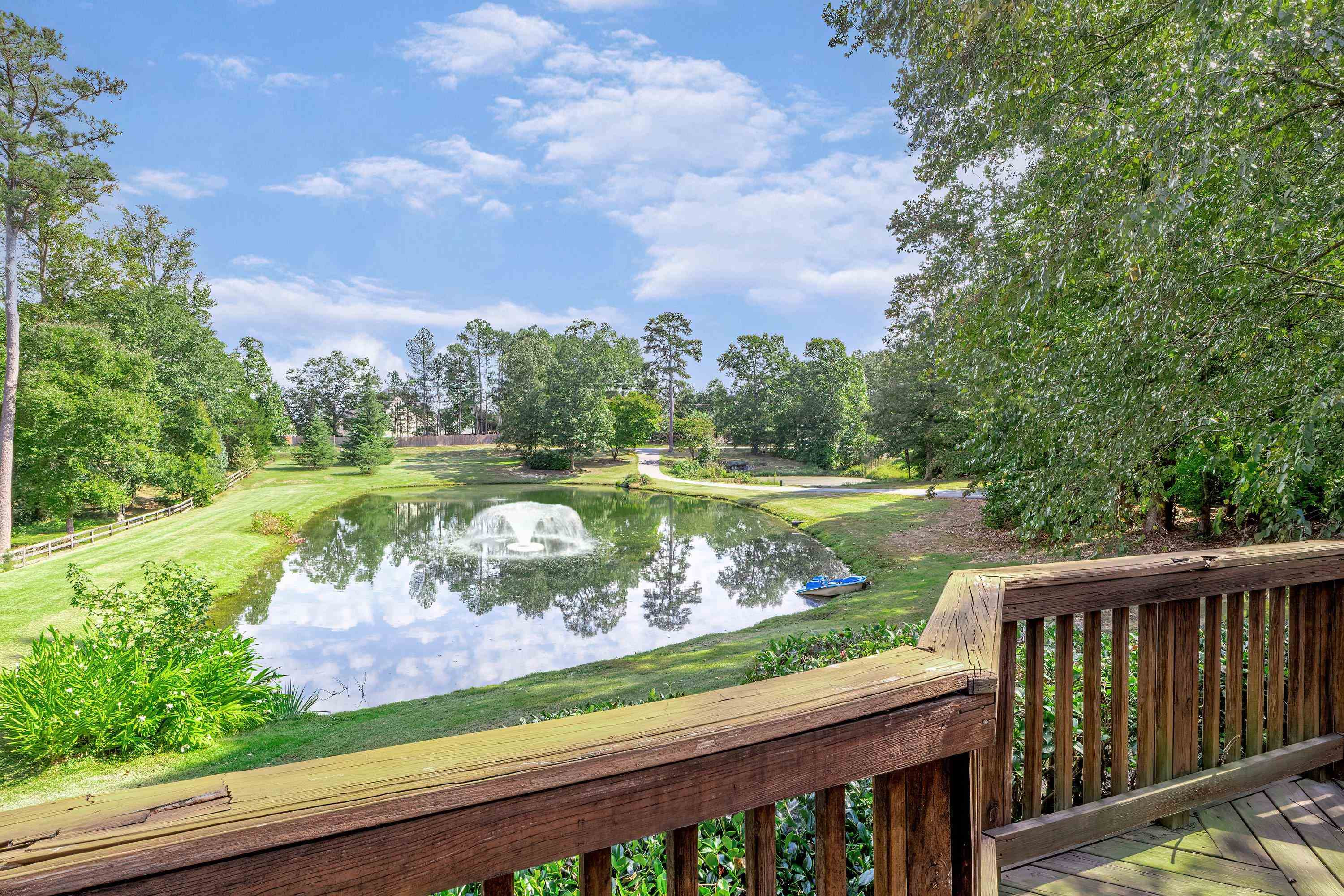 3509 Old Milburnie Road Raleigh, NC 27616 - Photo 6 of 74 a view of a lake with a garden