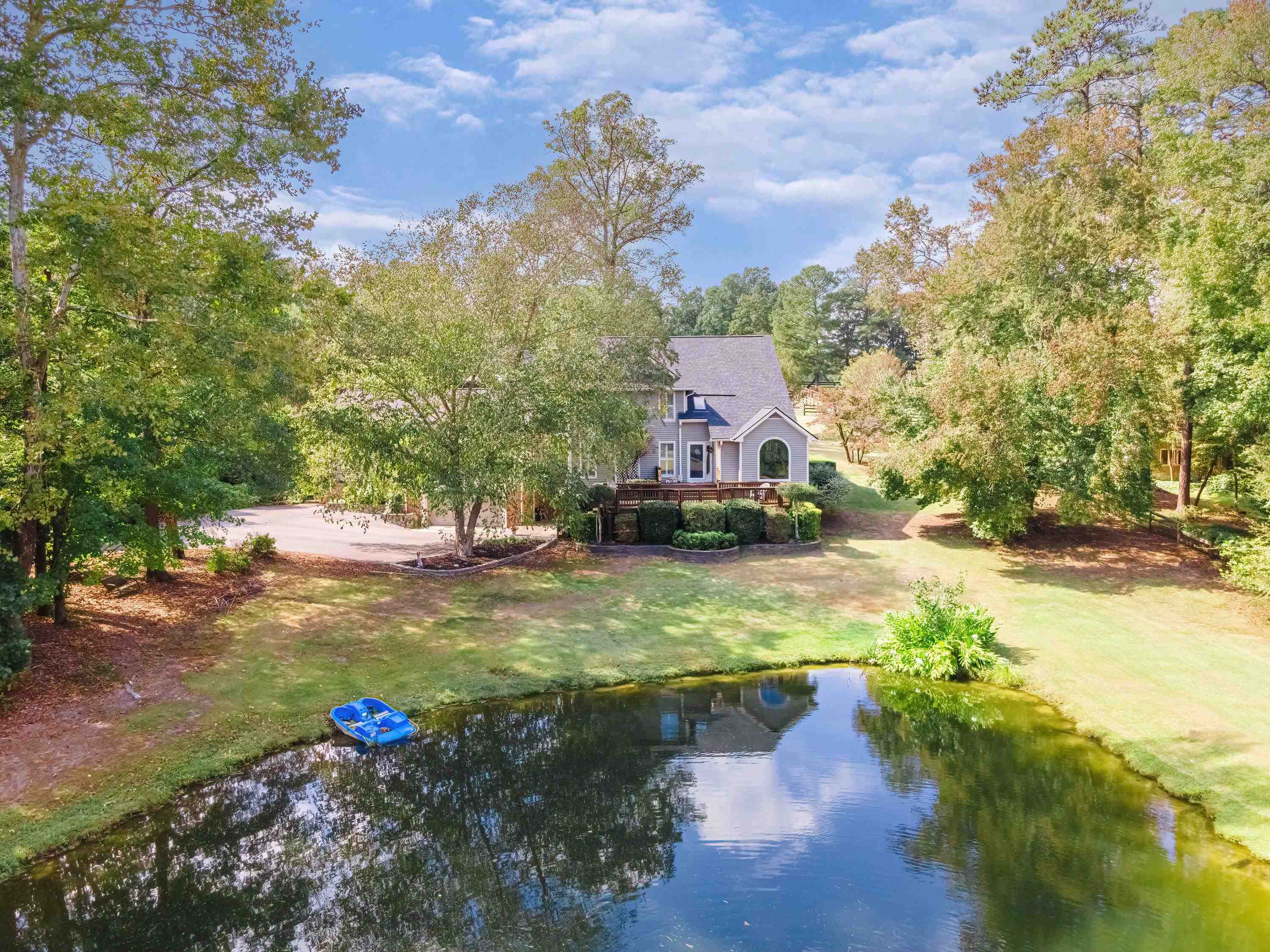3509 Old Milburnie Road Raleigh, NC 27616 - Photo 63 of 74 a swimming pool with trees in the background