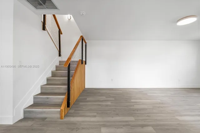 a view of entryway with wooden floor