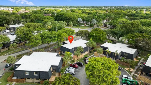 an aerial view of a house with yard swimming pool and outdoor seating