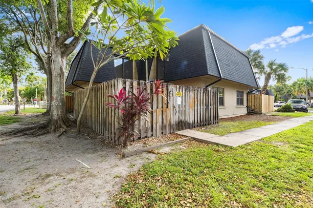 a view of a house with basketball court