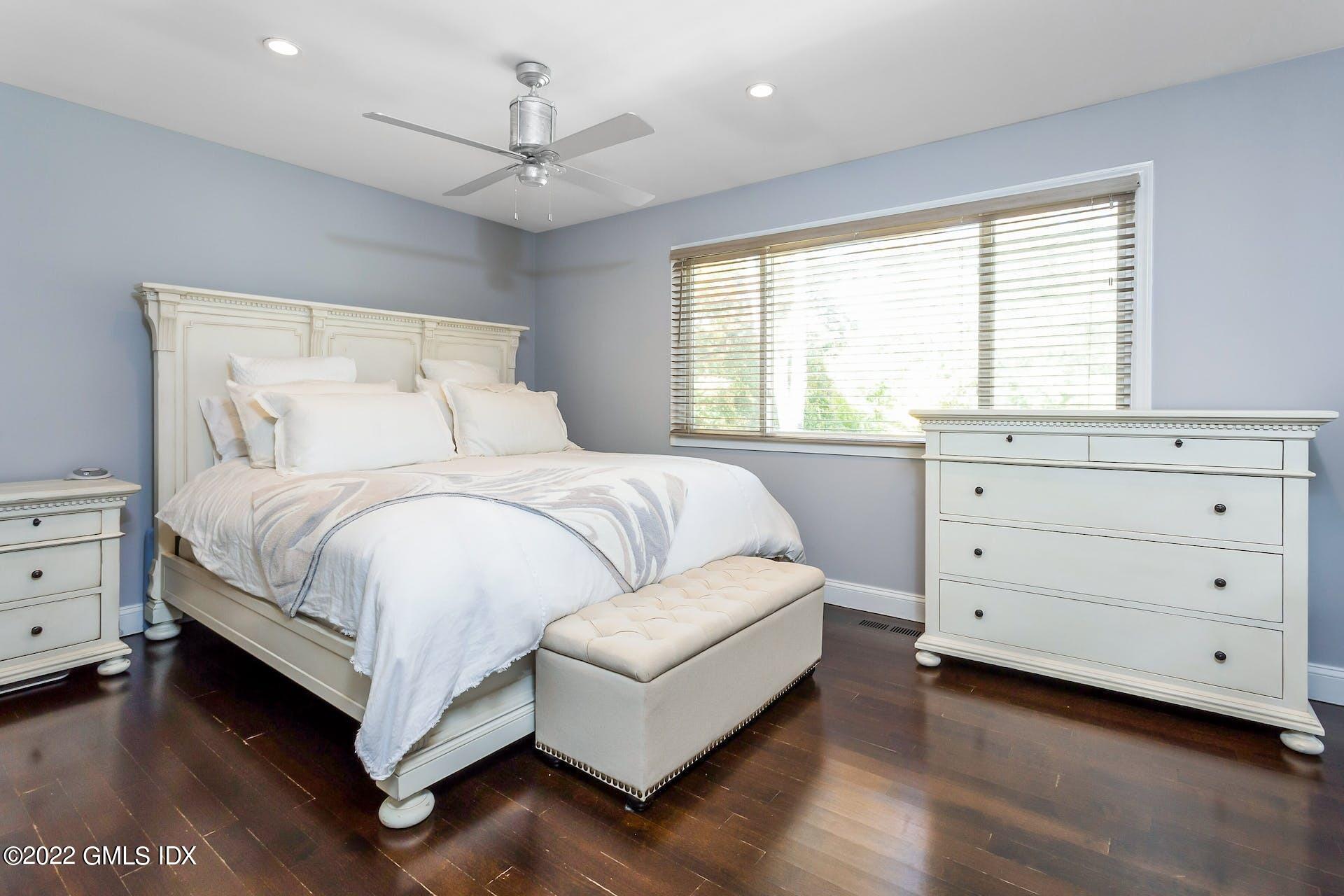 100 Silo Circle, Unit 100 Riverside, CT 06878 - Photo 6 of 22 a bedroom with a large bed and a dresser