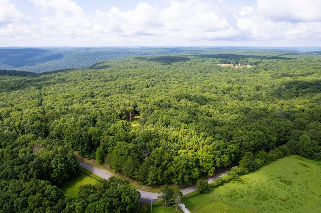 a view of a yard with an outdoor space