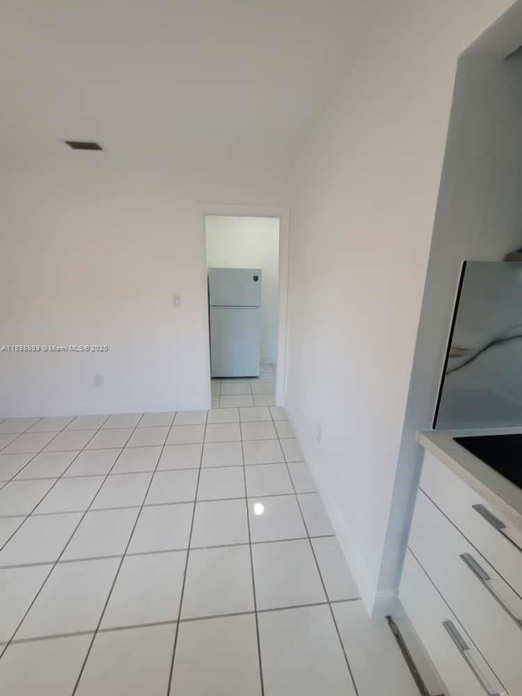 1120 Southwest 96th Avenue, Unit 1 Miami, FL 33174 - Photo 3 of 9 a view of a utility room and empty racks