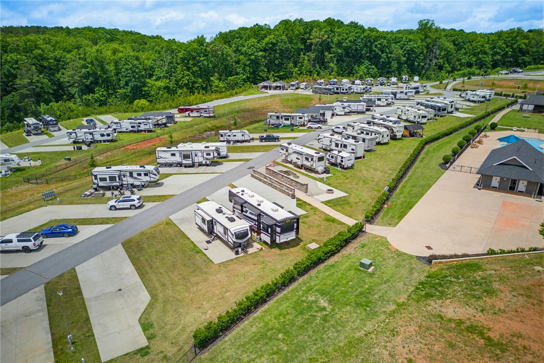 150 Dalton Drive, Unit 331/332 Pendleton, SC 29670 - Photo 8 of 29 RV resort with ample parking and a refreshing pool, nestled among verdant hills.