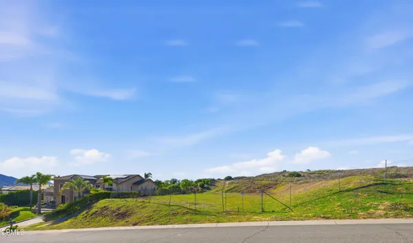 a view of an ocean and a mountain