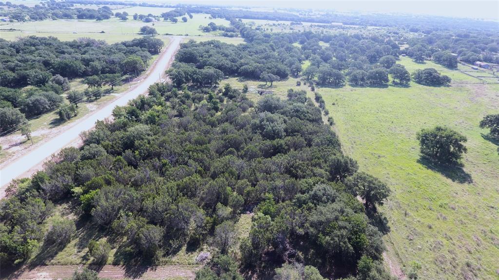 T4 Coleman Ranch Road Tolar, TX 76476 - Photo 5 of 17 a view of a lake with beach and green space